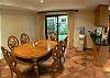 Living area with table for six guests and comfortable leather chairs and water cooler/heater at Casa Colonial at Hermosa Palms gated community in Playa Hermosa, Costa Rica