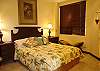 Second bedroom with Queen bed, closet and direct access to shared bathroom with both bathtub and shower at Casa La Ostra vacation rental house in the exclusive Hermosa Palms beachfront gated community, Playa Hermosa, Costa Rica