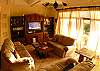 Upstairs Living area with 42 inch flat screen TV, Home Theater and DVD library at Casa Tortuga vacation rental home at Hermosa Palms in Playa Hermosa, Costa Rica