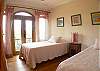 Third bedroom with Twin size beds and closet, all with a pink theme at the main house of Villa Oceana vacation rental in Esterillos Este, halfway between Jaco and Manuel Antonio, Costa Rica