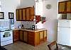 Full kitchen stove, oven, microwave, coffemaker, blender and other utensils, as well as a stacked washer and dryer, at our Mar Arena beachfront vacation rental condo in Jaco, Costa Rica