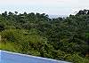 Pool with infinity edge and ocean and rainforest view at Casa Infinito luxury vacation rental home at Valle Perdido in Playa Hermosa, Costa Rica