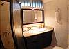 Ensuite Bathroom with shower and granite countertop within the Pool view Bedroom at Casa Miguel vacation rental house in Jaco, Costa Rica, 8 minute walk to the beach and downtown.