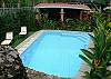 Pool area and gazebo with gas grill at Casa Miguel vacation rental house in Jaco beach
