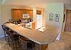 Kitchen and breakfast bar with seating for 4 at Del Mar 5N vacation rental condo at Los Suenos Resort & Marina, Playa Herradura, Costa Rica