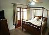 Second Bedroom with Queen bed, TV, closet, dressers and ensuite bathroom at Rio Copey vacation rental in Jaco, walking distance to beach and main street.