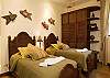 Third bedroom with two Twin beds, closet, black-out curtains and ensuite bathroom at Hermosa Palms Villa La Costa vacation luxury rental in Playa Hermosa, Costa Rica