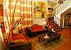 Living room with comfortable rustic furniture for 6, TV,Stereo and DVD at La Flor Rustico beachfront vacation rental in Jaco, Costa Rica