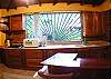 Large, fully equipped Kitchen (except oven) with view of the pool area at Casa Miguel vacation rental house in Jaco, Costa Rica, just 8 minutes walk to the beach and downtown.