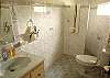 Bathroom with shower shared by Bedroom 5 and 6 upstairs at Casa Miguel vacation rental house in Jaco, Costa Rica, 8 minute walk to the beach and downtown.