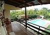 View of the pool area from balcony outside of first bedroom at Rio Copey vacation rental in Jaco, walking distance to beach and main street.