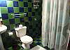 Bathroom with shower inside Bedroom 2 at Casa Gris vacation rental home in Jaco, Costa Rica
