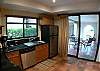 Fully equipped Kitchen with granite counter top, dishwasher, ceramic stove top and adjacent laundry room with washer and dryer, at Casa Colonial at Hermosa Palms gated community in Playa Hermosa, Costa Rica
