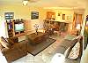 Living area with comfortable seating for 4 and TV at Del Mar 5N vacation rental condo at Los Suenos Resort & Marina, Playa Herradura, Costa Rica