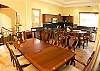 Dining table for 8 guests and gourmet kitchen with breakfast bar island at Casa Tortuga vacation rental house at Hermosa Palms in Playa Hermosa, Puntarenas, Costa Rica