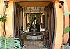 Entrance Foyer with stone fountain (no water) and vegetation at Casa Tortuga vacation rental house at Hermosa Palms in Playa Hermosa, Puntarenas, Costa Rica