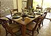 The table is set for six guests at this beautiful wooden dining table in the living area at Casa La Ostra vacation rental house in the exclusive Hermosa Palms beachfront gated community, Playa Hermosa, Costa Rica