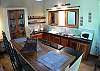 Kitchen and dining table at Quinta Teca vacation rental house at Opera Salvaje Playa Hermosa de Jaco