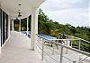 Tiled and covered terrace at Casa Infinito luxury vacation rental home at Valle Perdido in Playa Hermosa, Costa Rica
