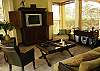 This is the beautiful decorated living room with TV, DVD, Stereo and access to the terrace and pool at Casa La Ostra vacation rental house in the exclusive Hermosa Palms beachfront gated community, Playa Hermosa, Costa Rica