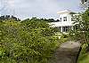 View from down the street at Casa Infinito luxury vacation rental home at Valle Perdido in Playa Hermosa, Costa Rica