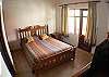 First Bedroom with Queen bed, TV, closet, dressers and ensuite bathroom at Rio Copey vacation rental in Jaco, walking distance to beach and main street.