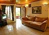 Comfortable couch in the living room with central AC, TV, DVD and wireless Internet at Villa Jaco Sol, Vacation Rental, Jaco Costa Rica.