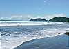 Jaco beach looking north near Mar Arena vacation rental condominiums in Jaco, Costa Rica