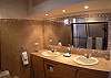 Master bathroom with double sink and both interior and exterior showers at Hermosa Palms Casa McDermott vacation rental house in Hermosa beach, near Jaco, Costa Rica.