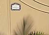 Detail of the front wall with ceramic name plate of Casa Milagro, beachfront vacation rental villa in Jaco, Costa Rica