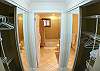 Double closet with sliding glass doors leading to Master Bathroom, at Del Mar 5N vacation rental condo at Los Suenos Resort & Marina, Playa Herradura, Costa Rica