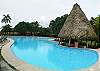 Community pool area and beach at Hermosa Palms gated community in Playa Hermosa, Puntarenas, Costa Rica