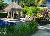 Pool and palm thatched Gazebo (perfect for a relaxing massage) at Casa Milagro beachfront vacation rental villa in Jaco, Costa Rica