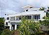 View from southwest showing all three levels and support pillars at Casa Infinito luxury vacation rental home at Valle Perdido in Playa Hermosa, Costa Rica