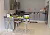 Kitchen with breakfast table and barstools