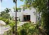 View from the street as one arrives at Casa Infinito luxury vacation rental home at Valle Perdido in Playa Hermosa, Costa Rica