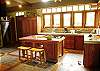 This is the fully equipped kitchen with a beautiful view of the pool and garden at Sonidos del Mar, Vacation Rental, Jaco Costa RIca.