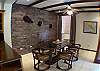 Glass top dining table with 6 chairs next to kitchen at Hermosa Palms Casa McDermott vacation rental house in Playa Hermosa, Puntarenas, near Jaco, Costa Rica