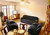Living area with TV and air conditioning at Rio Copey vacation rental in Jaco, walking distance to the beach and main street.