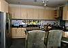 Kitchen and breakfast bar at Casa Infinito luxury vacation rental home at Valle Perdido in Playa Hermosa, Costa Rica
