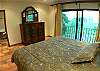 Master Bedroom with ocean view, wood frame King Bed, ample closet space and ensuite bathroom  at Casa Colonial at Hermosa Palms gated community in Playa Hermosa, Costa Rica
