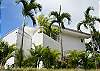 View as you walk down the street past Casa Infinito luxury vacation rental home at Valle Perdido in Playa Hermosa, Costa Ricav
