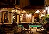 Pool and courtyard by night at Villa Antigua luxury vacation rental home in south Jaco beach, Costa Rica