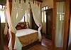 Another view of this beautiful canopy queen bed at Sonidos del Rio, Vacation Rental, Jaco Costa Rica.