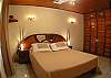 Master Bedroom with Double bed, black-out curtains and closet in Casita 1 at Villa Jaco Sol vacation rental in Jaco, Costa Rica, walking distance to beach and downtown