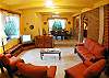 Living room with TV, DVD and seating for six at Casa Miguel vacation rental house in Jaco, Costa Rica