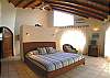 Master Bedroom with King bed, TV, safe, closet and ensuite bathroom at Casa Milagro beachfront vacation rental villa in Jaco, Costa Rica