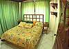 Double size bed in Room #2 at beachfront Casa Mandolina, Jaco Costa Rica
