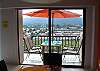 Outdoor terrace sitting area at Jaco Bay 4701 vacation rental condominium in Jaco beach. The umbrella is no longer available for security reasons.