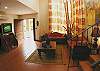 Living area with rustic furniture  at La Flor Rustico beachfront vacation rental in Jaco, Costa Rica